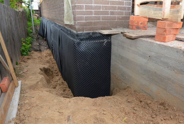 Happy homeowners after waterproofing job in Hastings
